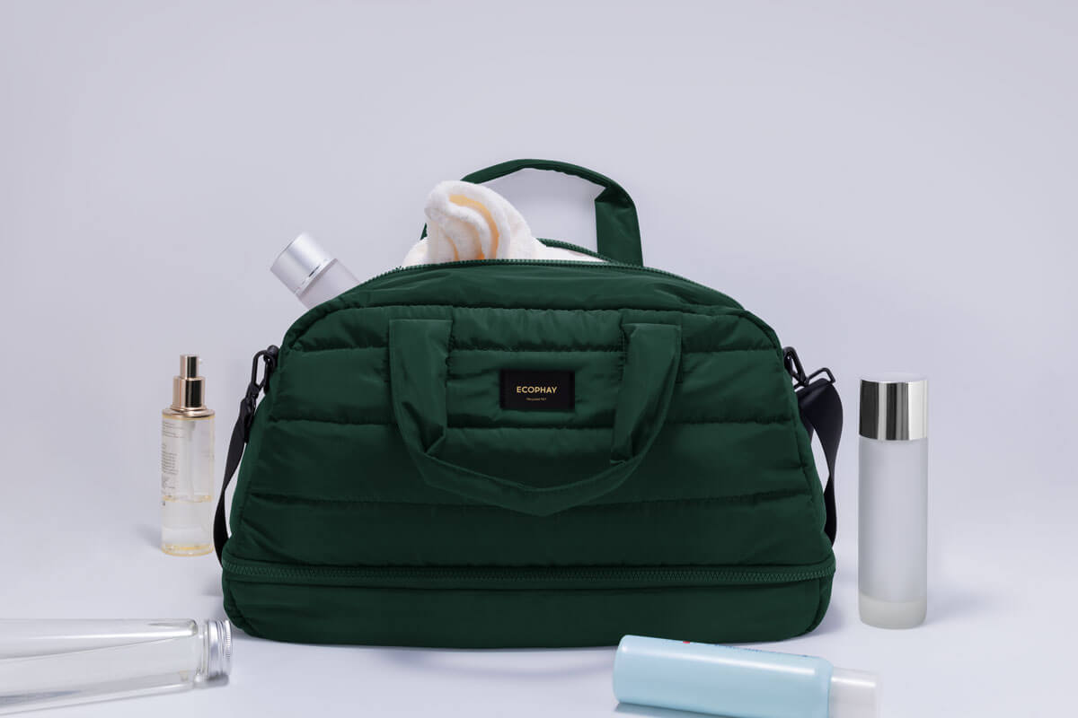 Green quilted beauty and toiletry bag with cosmetics